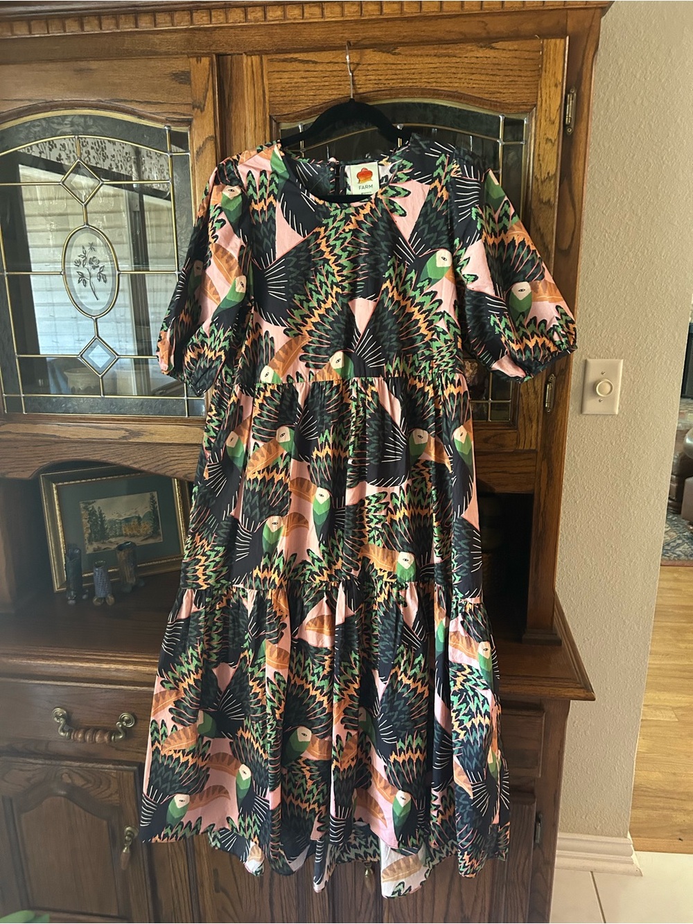 FARM Rio Toucani midi dress with puffed sleeves and beaded closure.